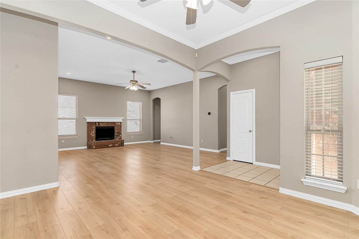 Living room with brick fireplace
